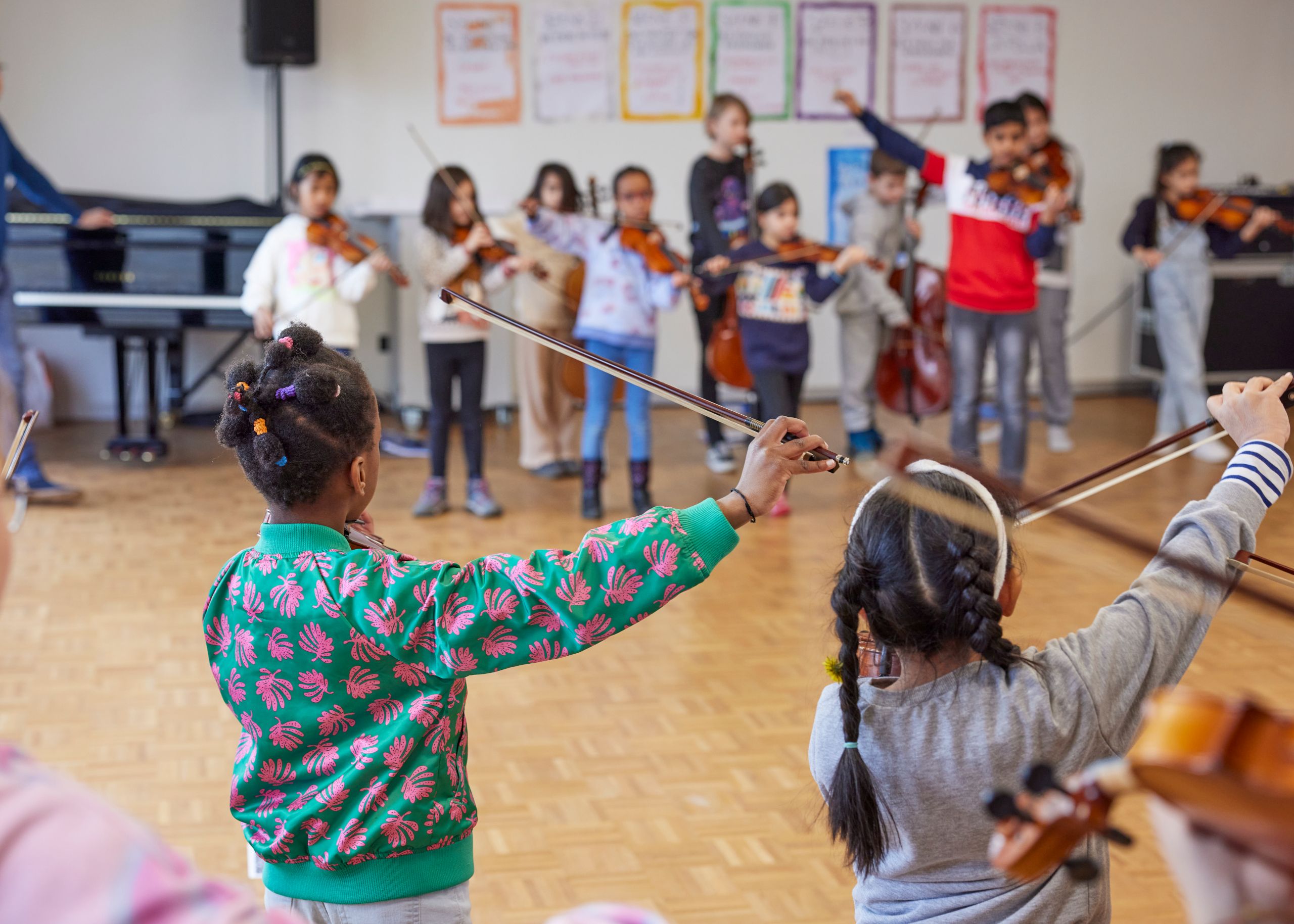 Group lessons with children who play string instruments.